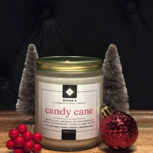 Alena’s Candy Cane soy wax candle with peppermint and vanilla fragrance, hand-poured with a wooden wick in a holiday gold tin.