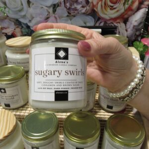 Sugary Swirls candle by Alena’s with notes of caramel, vanilla, and sweet sugar, hand-poured soy wax and wooden wick.