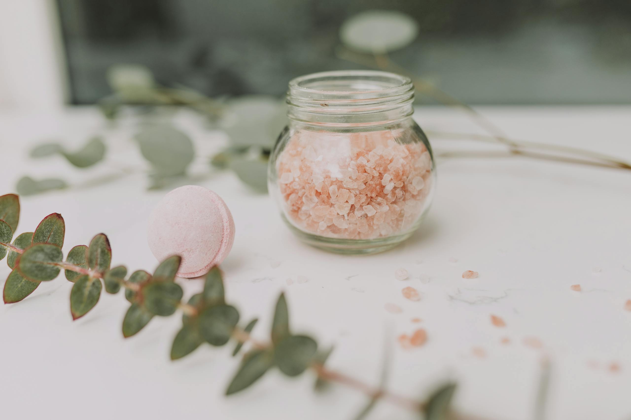 Customer Favourites — Start Here 22 Calming spa scene featuring pink bath salt and eucalyptus for a relaxing experience.
